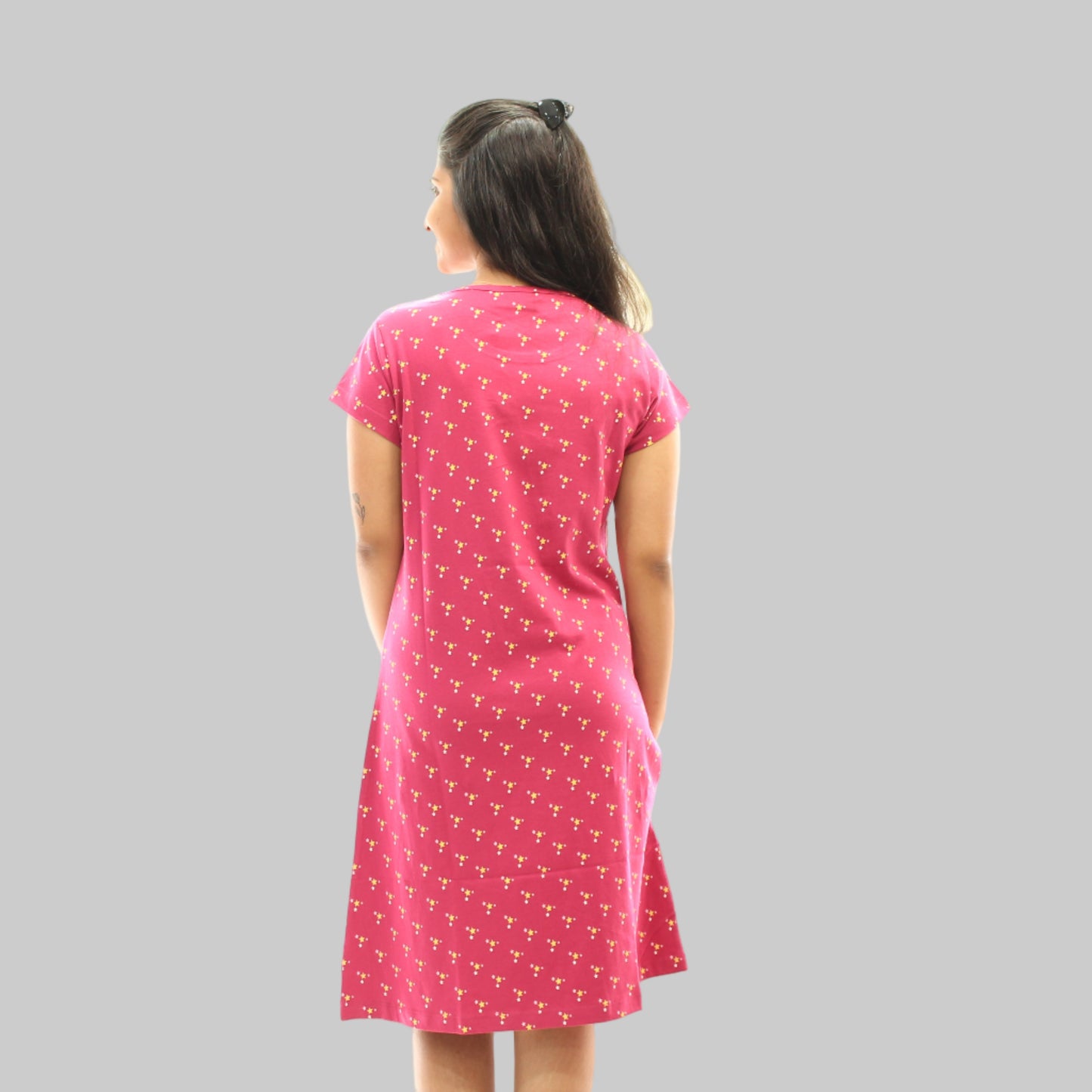back view of of women wearing red short nighty with yellow print design 