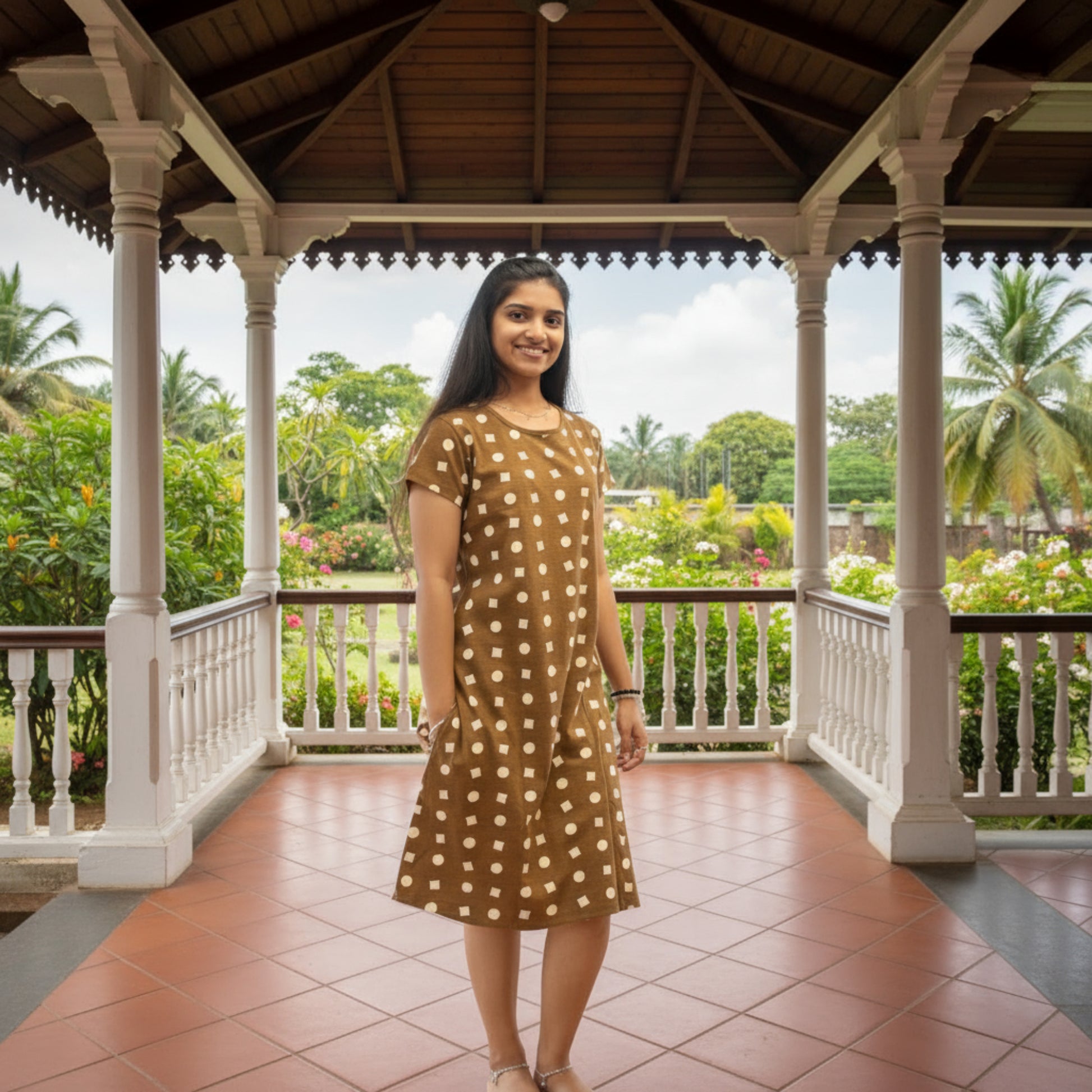 women wearing brown cotton short nighty with geometric print all over, hands in pocket