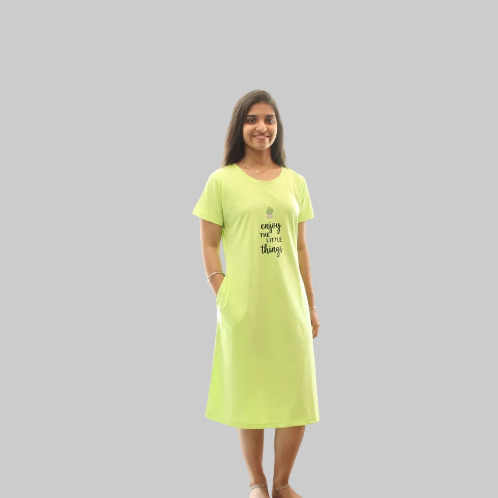 women wearing a parrot green color short nighty with hands in pocket