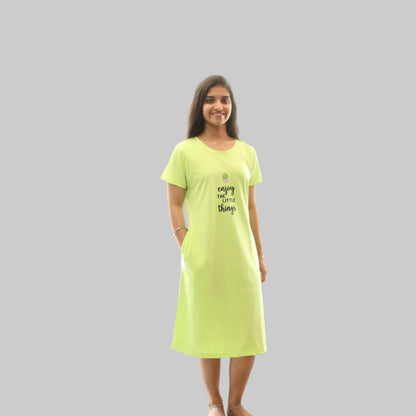 women wearing a parrot green color short nighty with hands in pocket