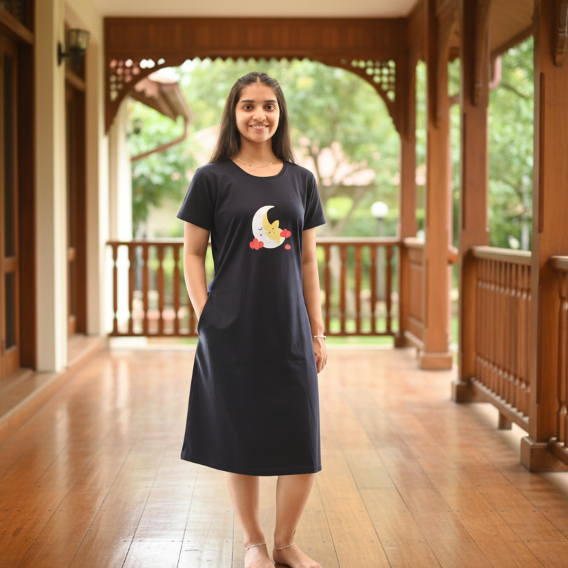 women wearing a dark navy knee length cotton short nighty with pocket