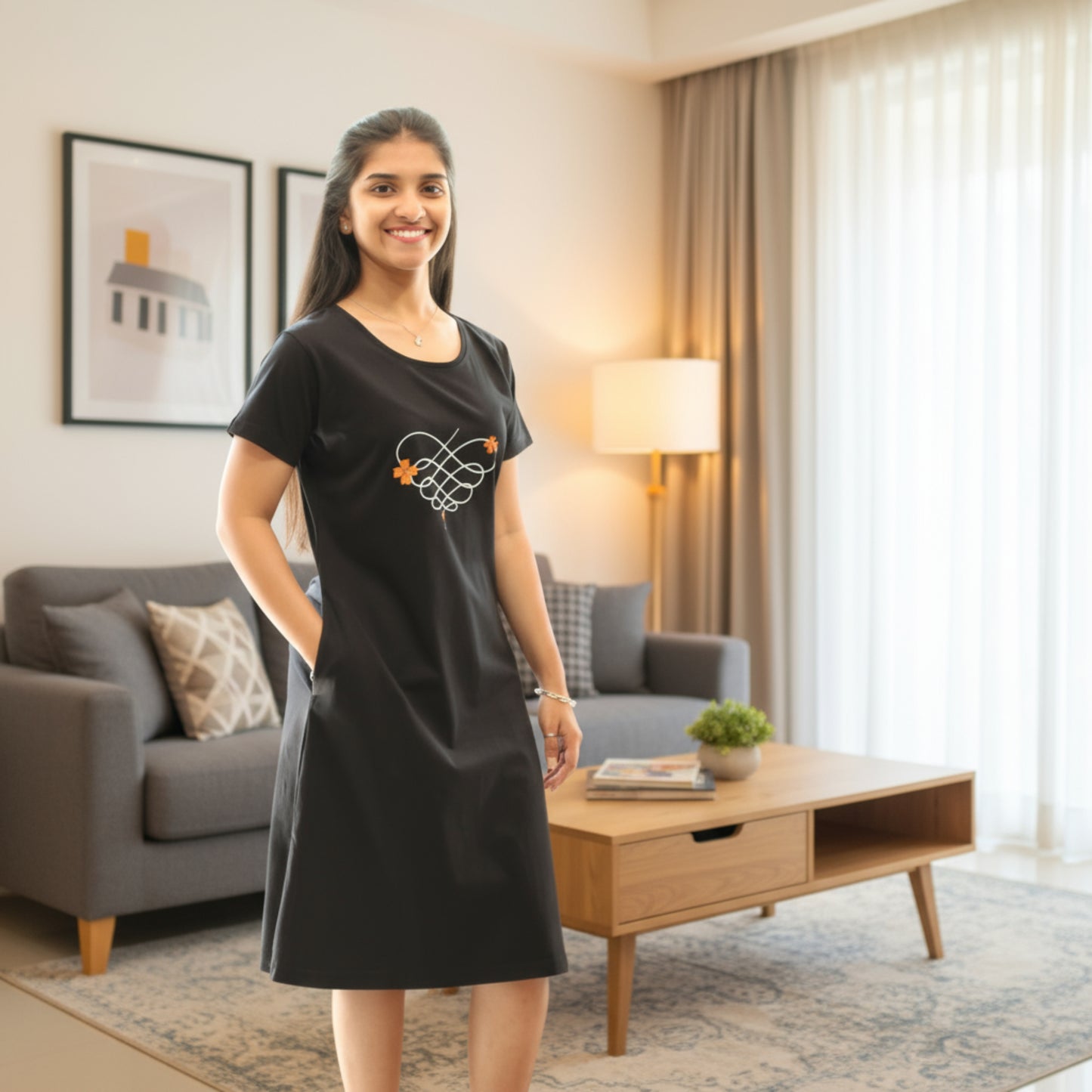 women wearing black color short gown, hands in pocket, floral print on chest area