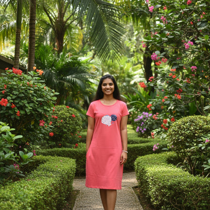 women wearing coral color cotton knee length short nighty , hands in pocket