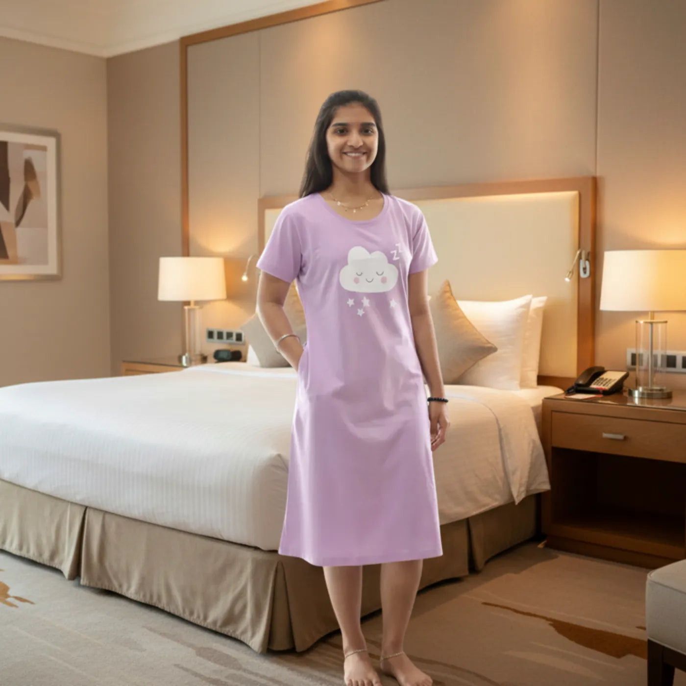 women wearing a lavender color cotton short nighty with cloud design standing in a bed room