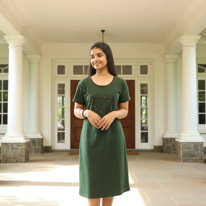 women standing in casual pose wearing green color cotton short nighty