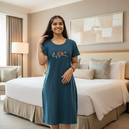 women wearing a teal blue color cotton short nighty 