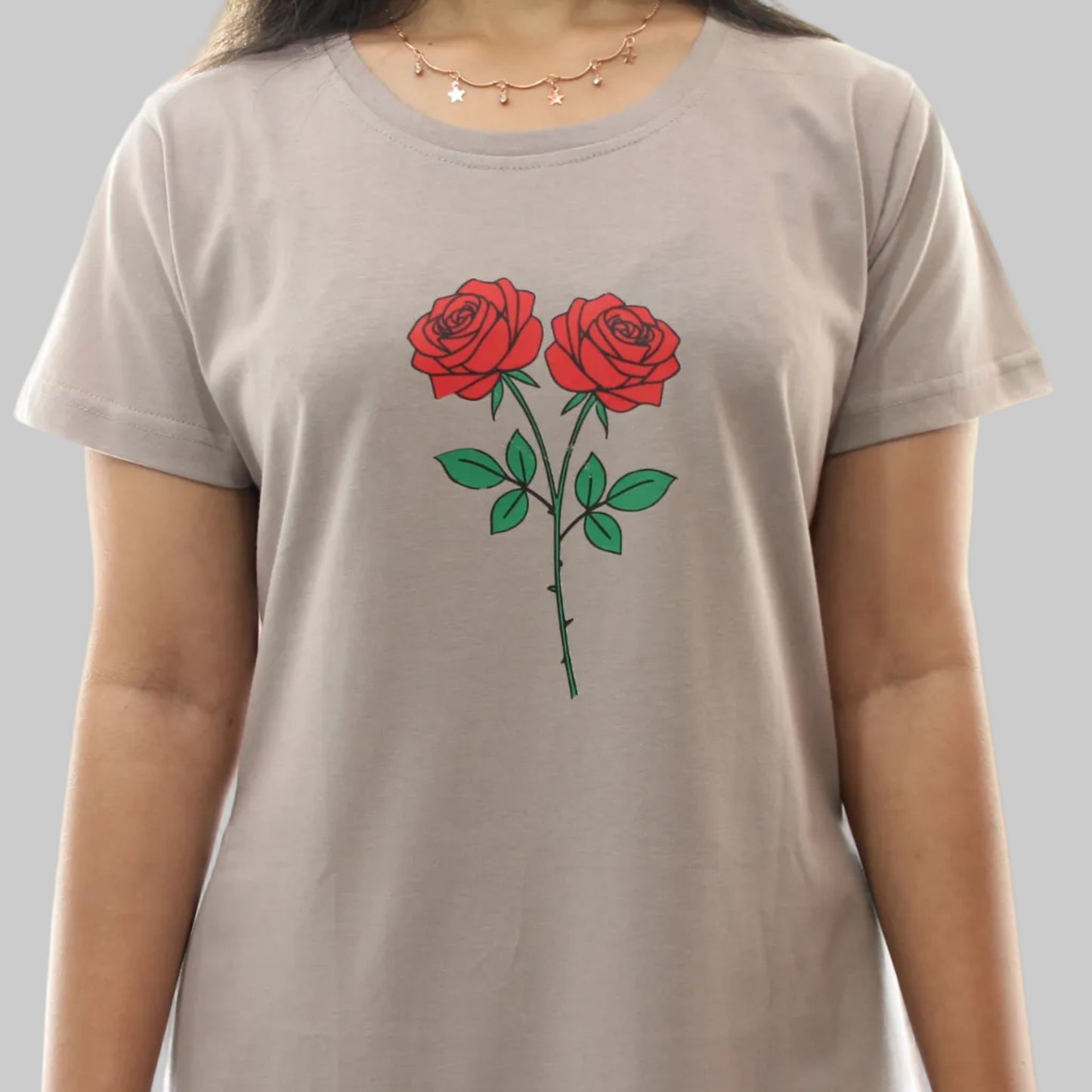 women wearing a light grey cotton short nighty with floral design in chest area