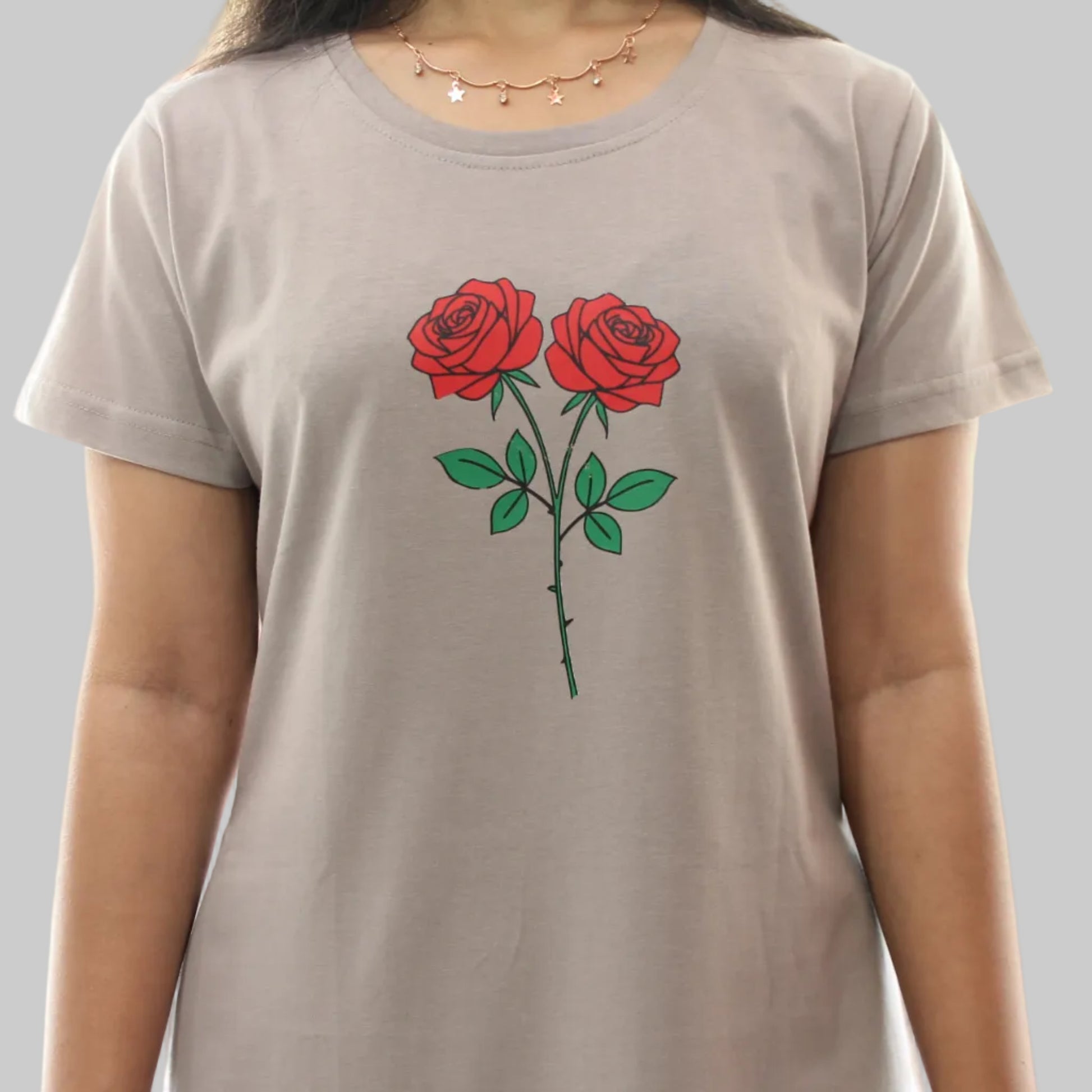 women wearing a light grey cotton short nighty with floral design in chest area