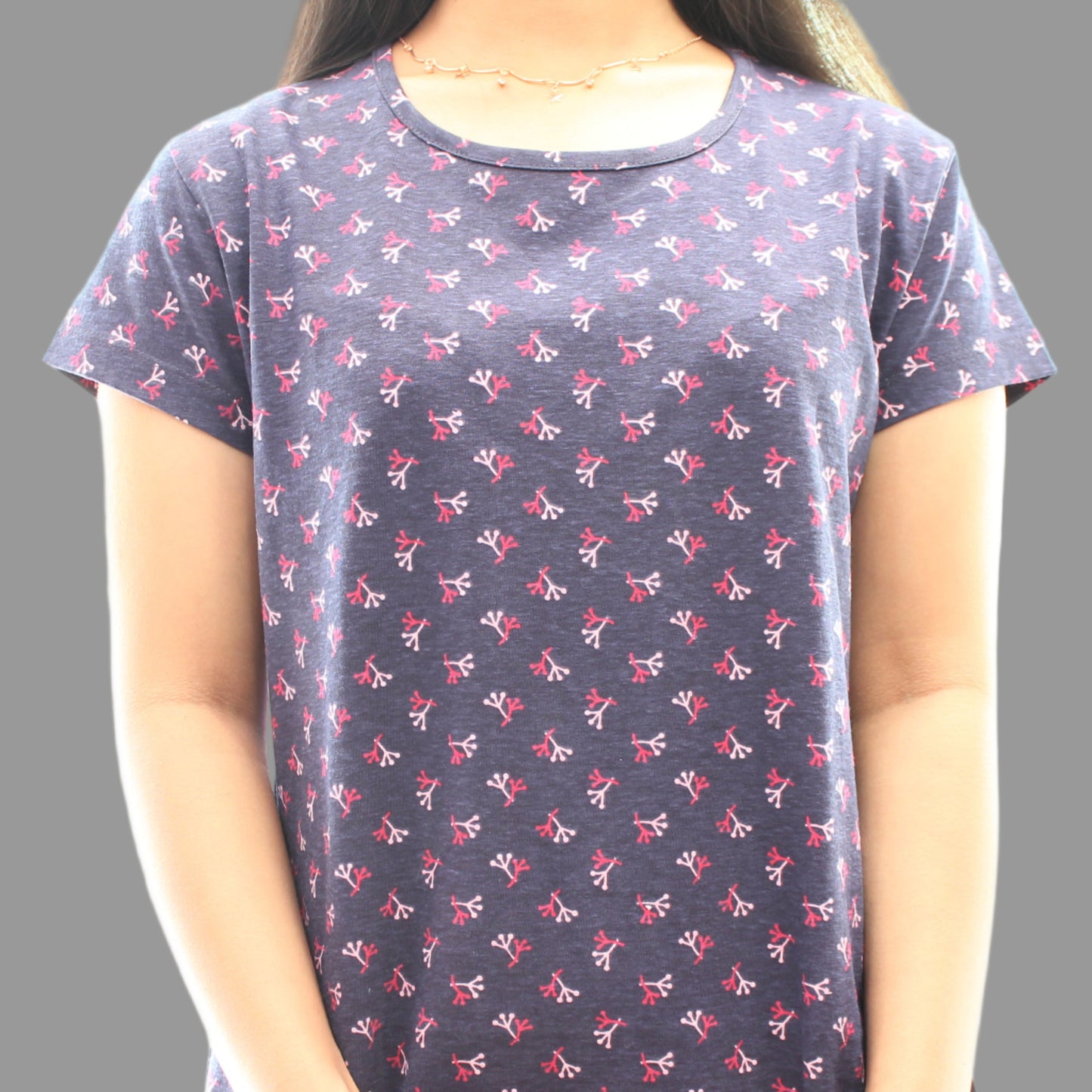 close up view of navy night short gown with all over print 