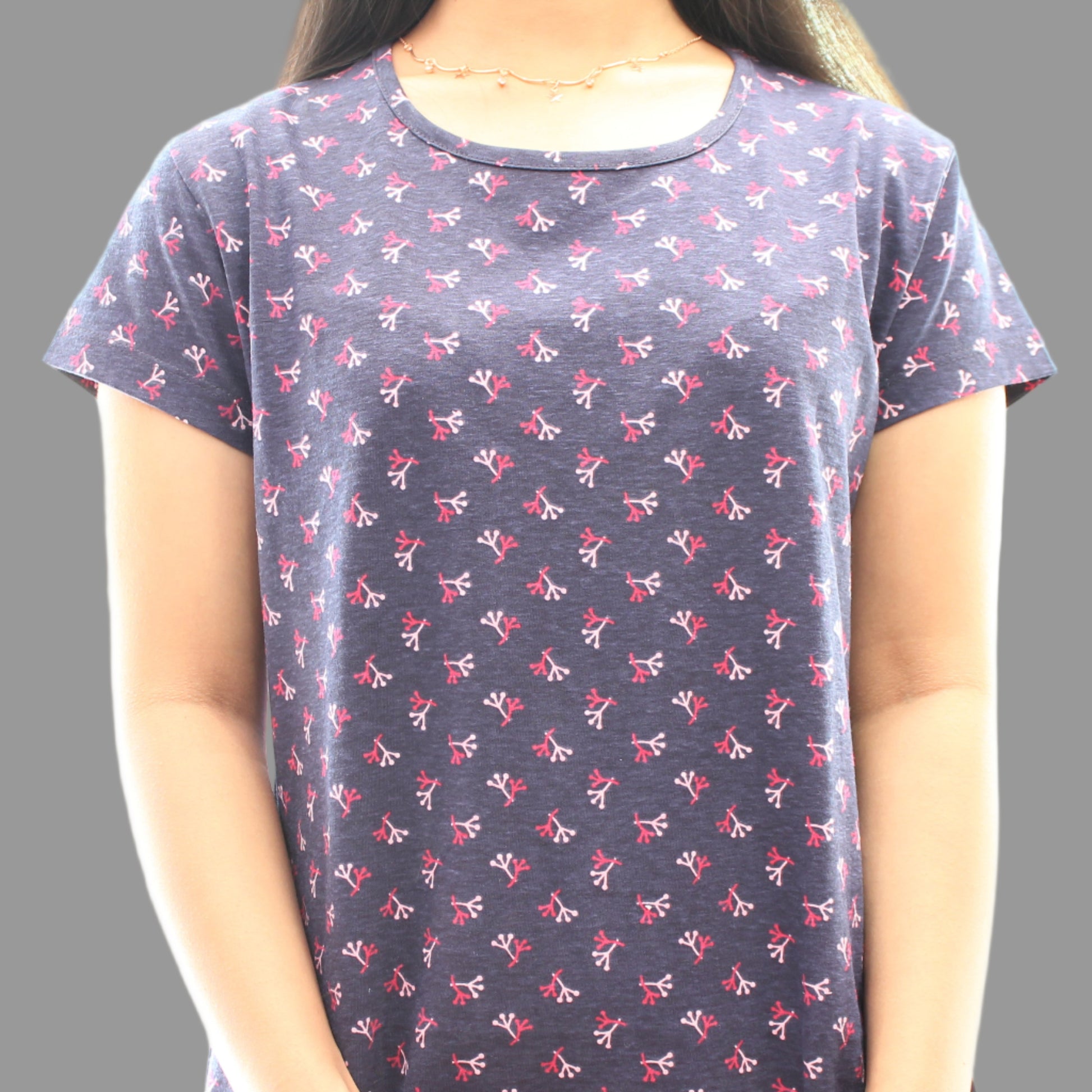 close up view of navy night short gown with all over print 