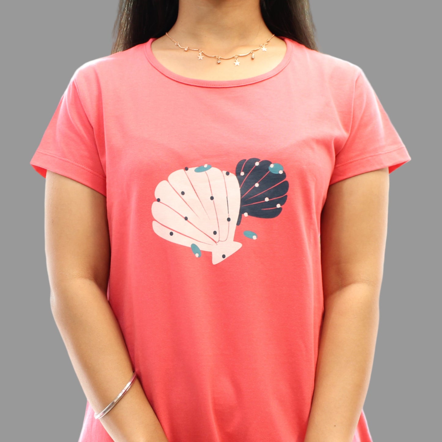 closeup view of chest print design in coral short nighty for women