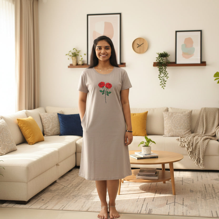 women wearing light grey color cotton knee length t shirt dress with floral design in chest area