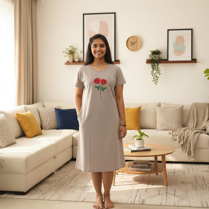 women wearing light grey color cotton knee length t shirt dress with floral design in chest area