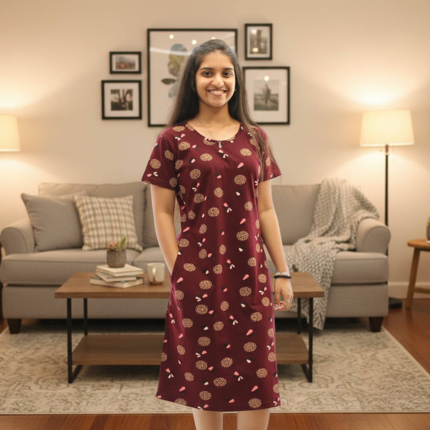 women wearing dark maroon cotton knee length short nighty with all over print design, it has a pocket