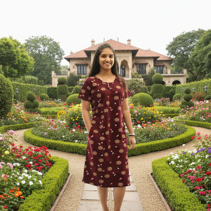 women wearing dark maroon cotton knee length short nighty with all over print design, it has pocket also