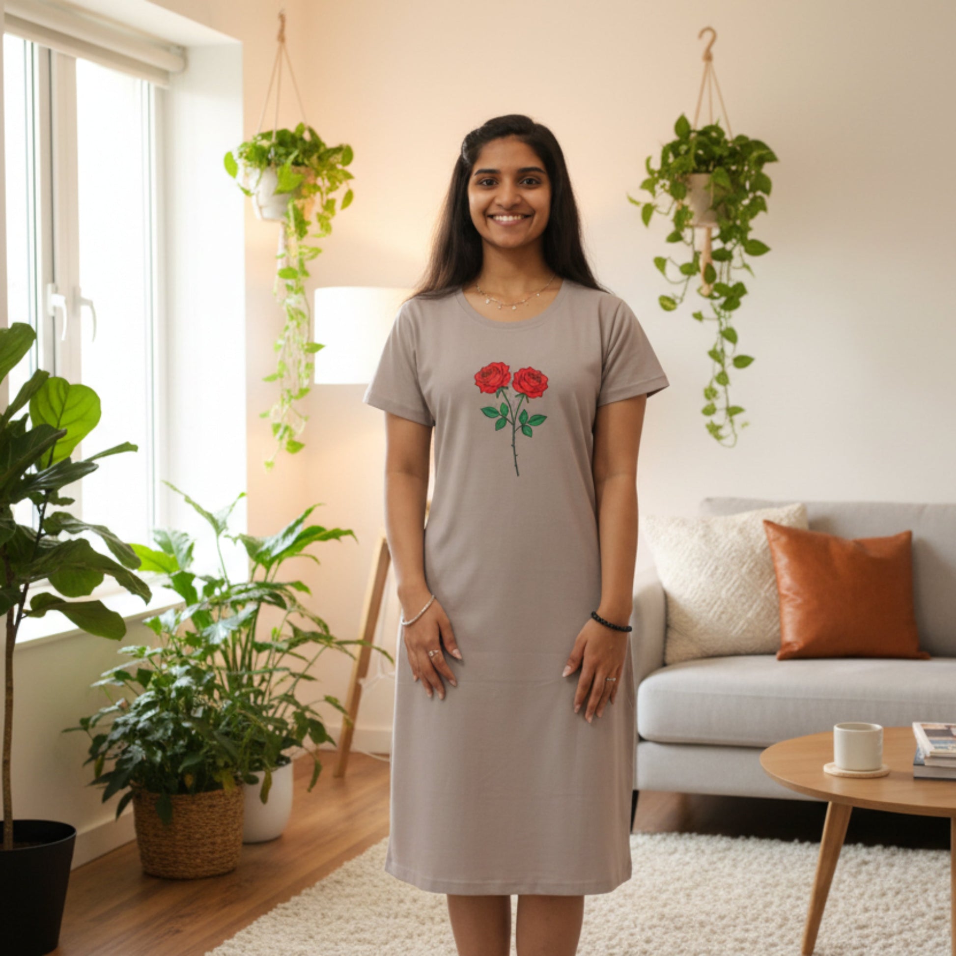 women wearing a light grey color cotton short nighty with floral design printed on chest area 
