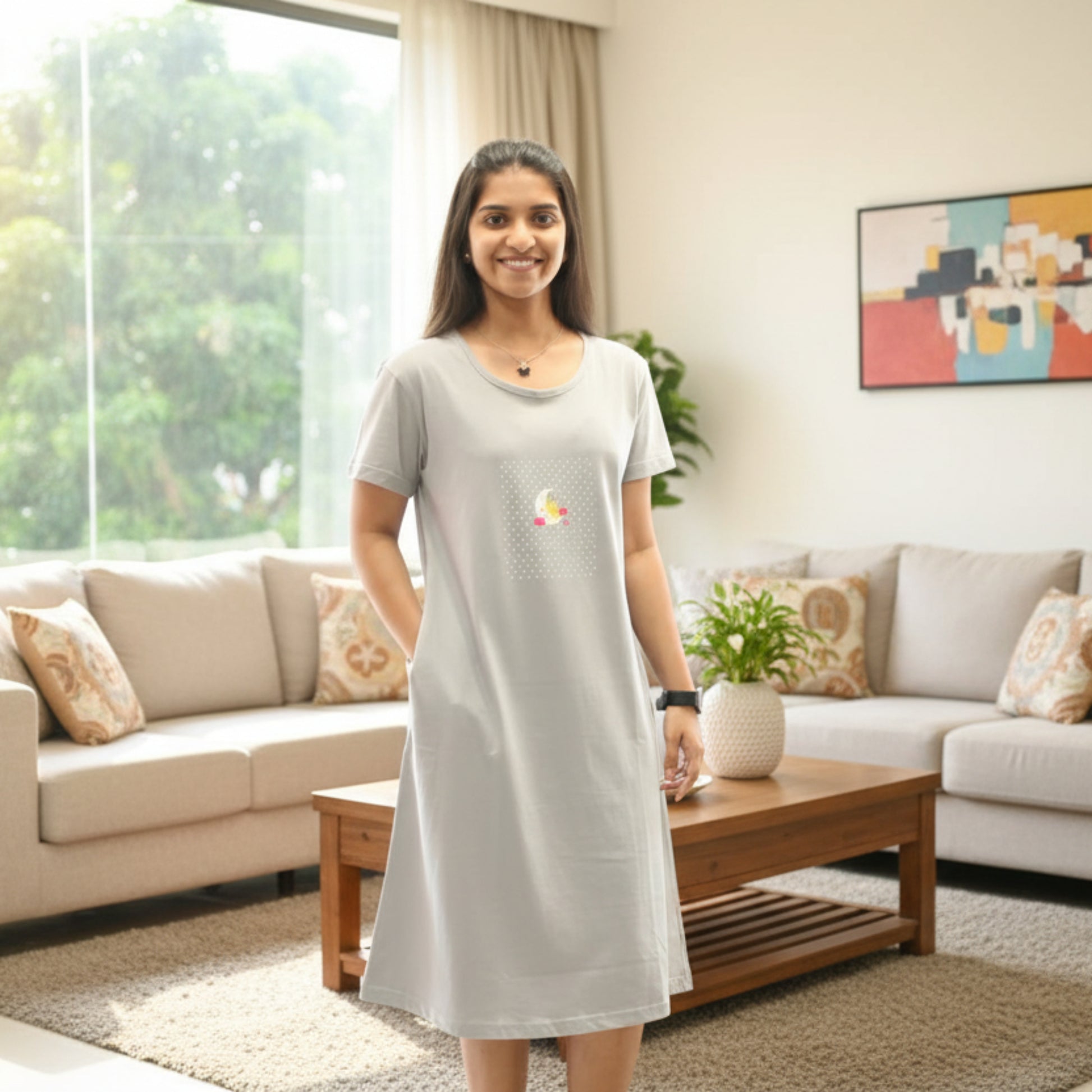 women wearing cotton knee length short nighty with hands in pocket, moon design in chest area 