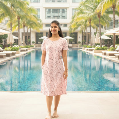women wearing a pink color short nighty with pocket