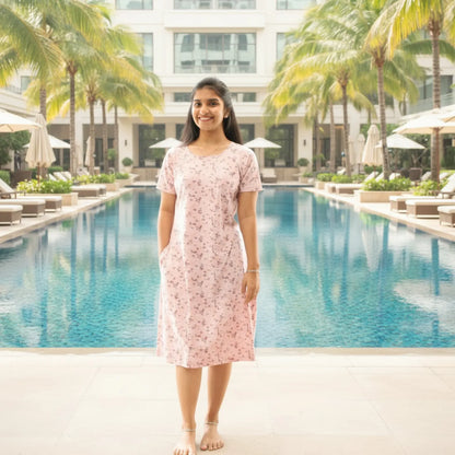 women wearing a pink color short nighty with pocket