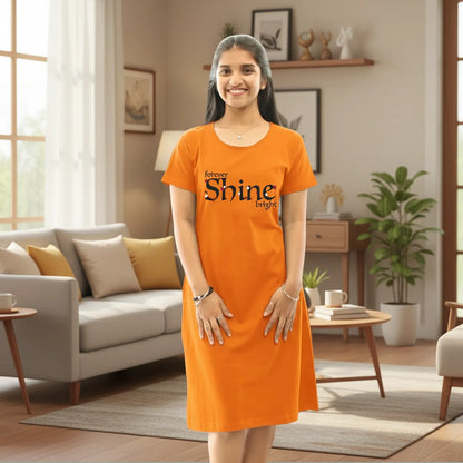 women wearing a orange color cotton knee length short nighty with text forever shine bright printed in chest area 