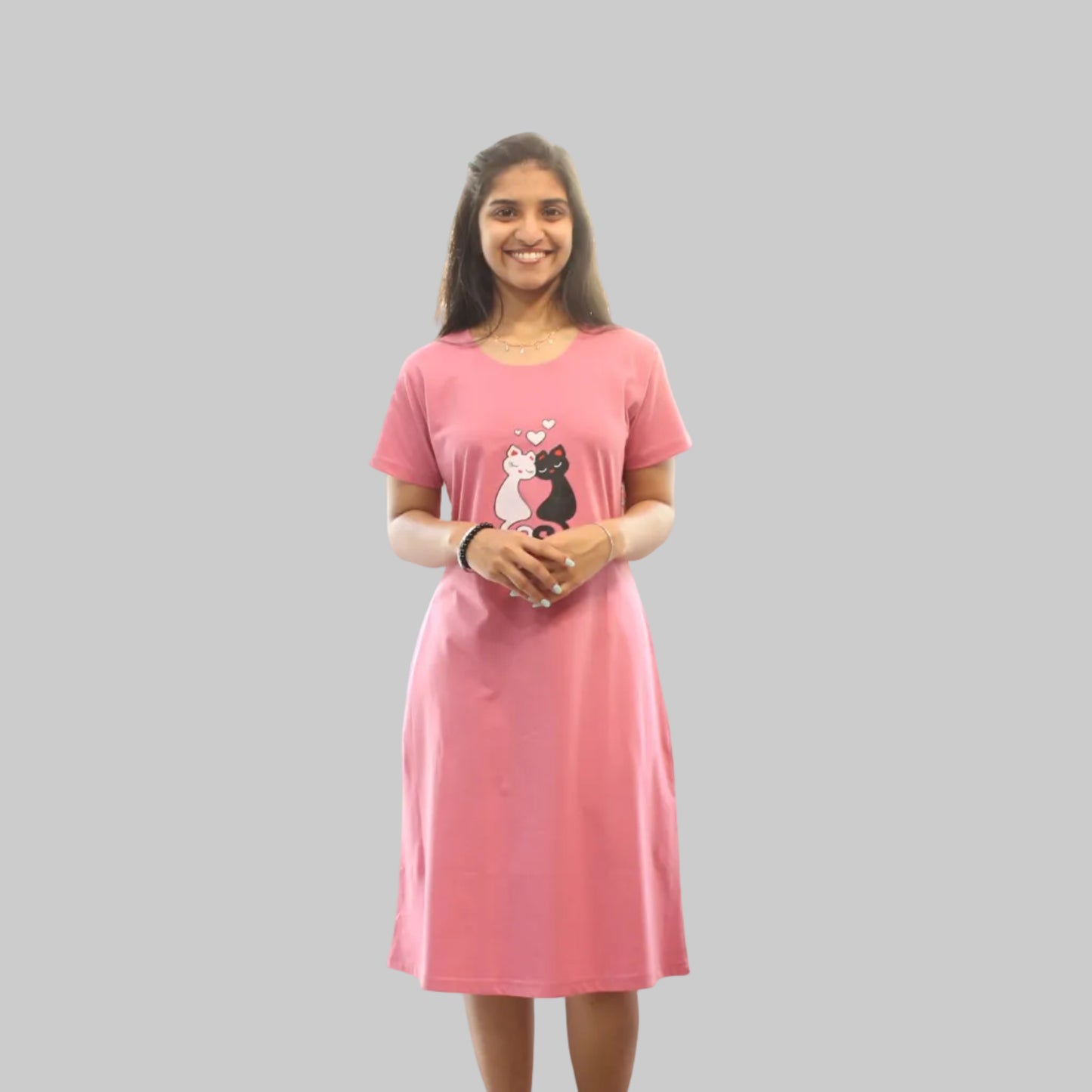 Woman wearing a pink dress with a cartoon character