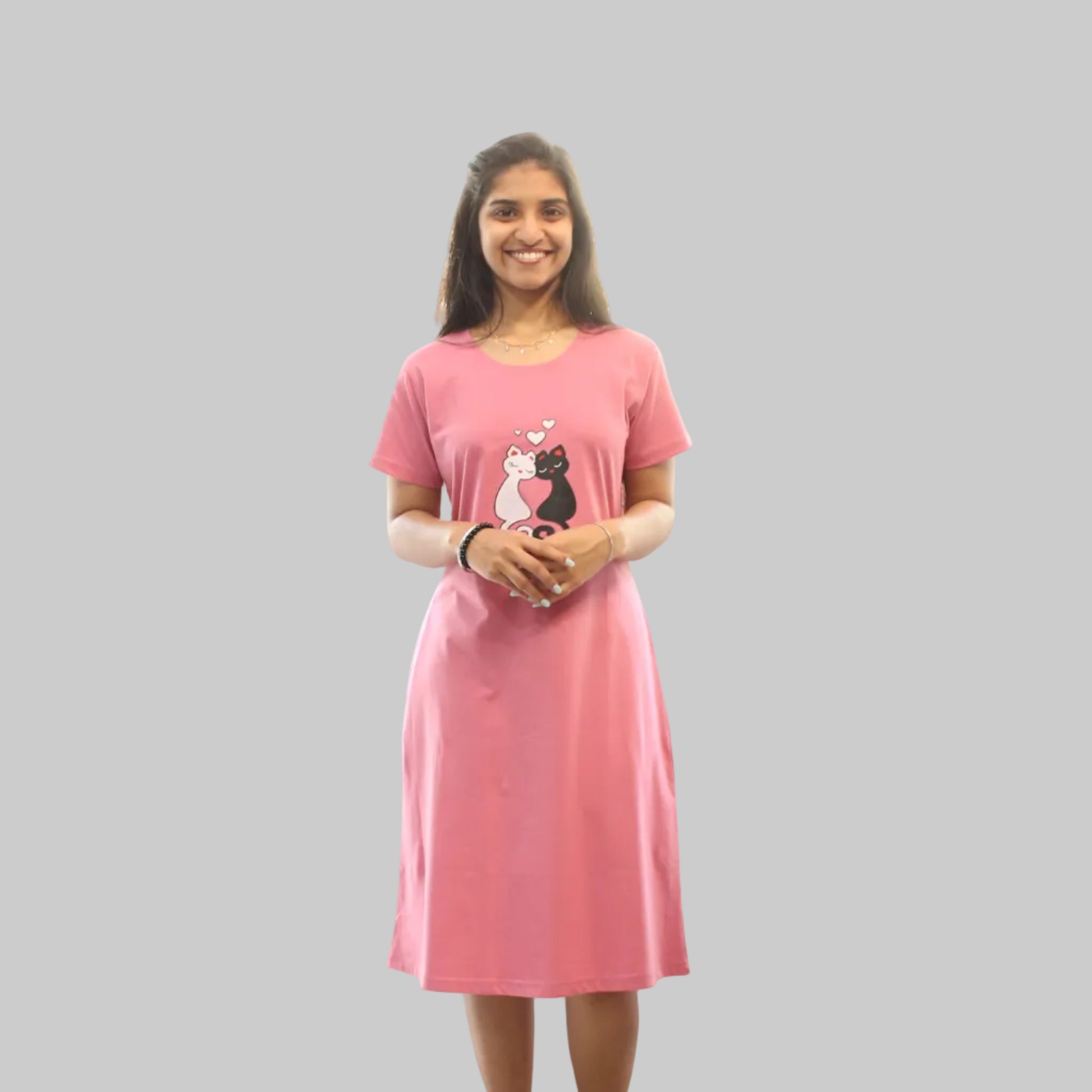 Woman wearing a pink dress with a cartoon character