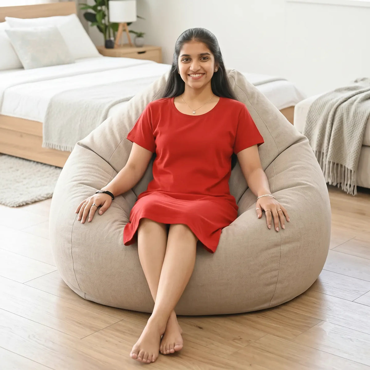 women sitting in a bean bag wearing a hosiery cotton knee length t-shirt dress