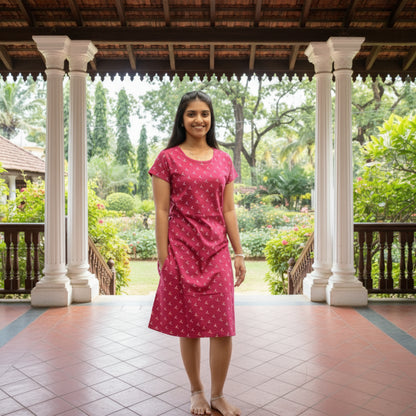 women wearing red color cotton knee length short nighty with yellow design printed on it, it has a pocket