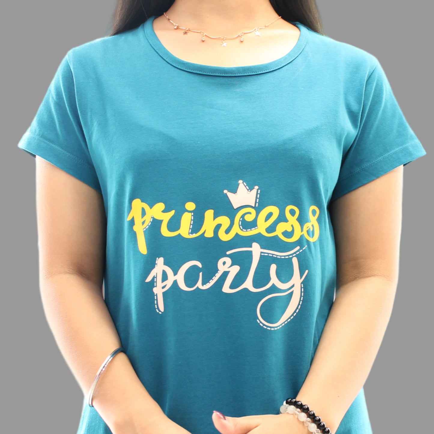 close up view of chest print in teal color short nighty