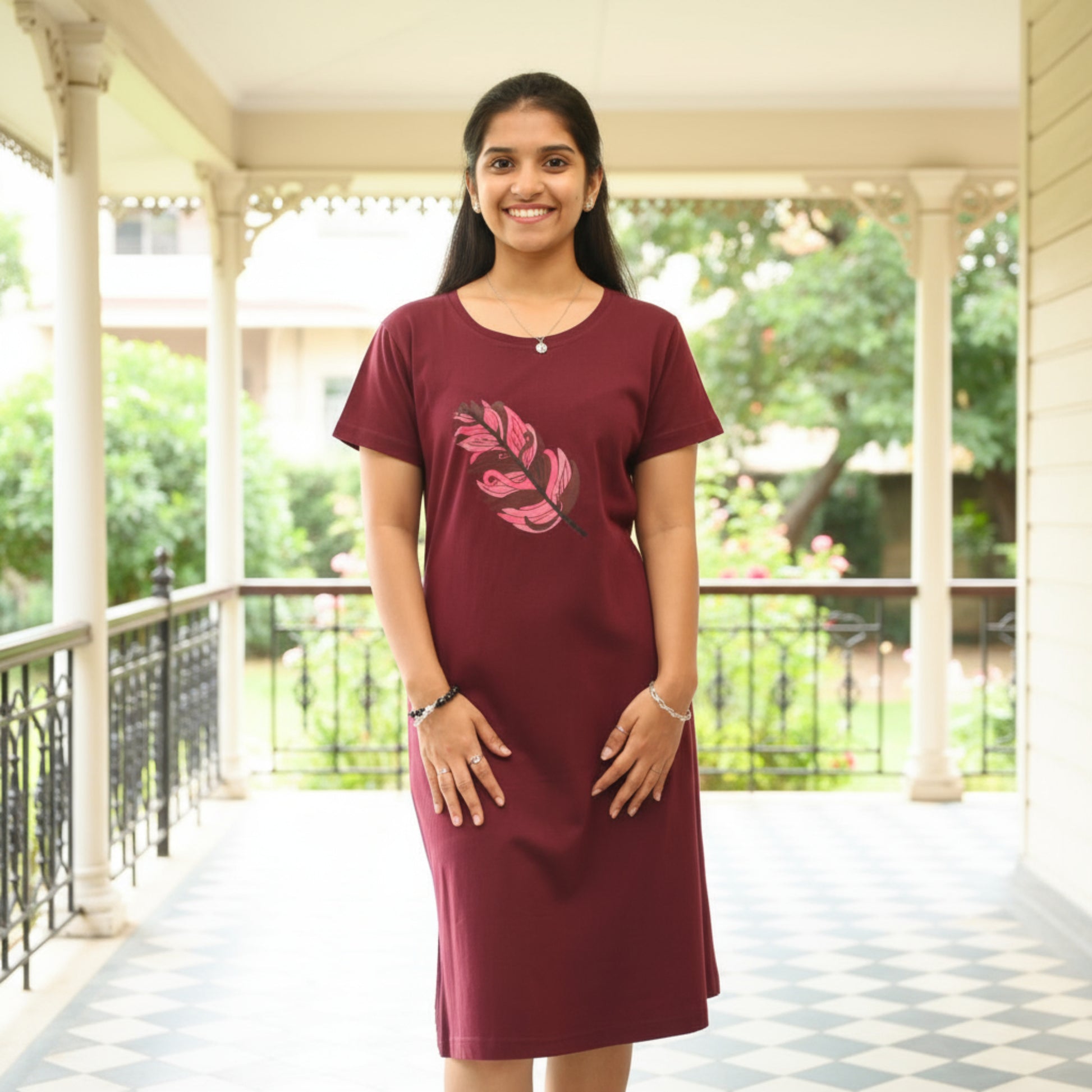 women wearing dark wine color short nighty with leaf design printed on chest