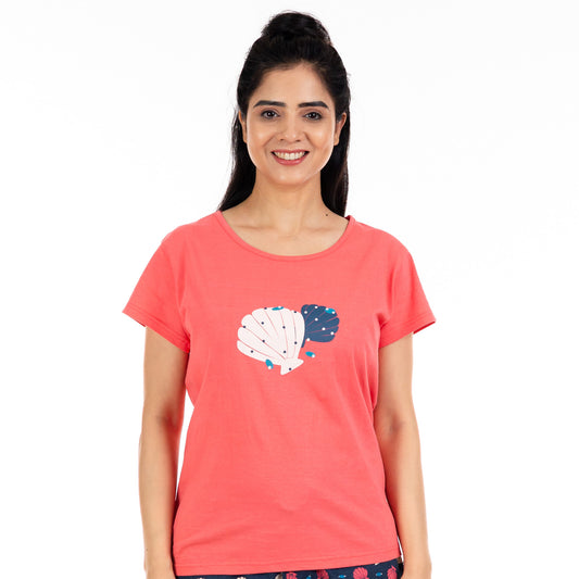 coral color t-shirt with shell print on the neck, round neck and short sleeves