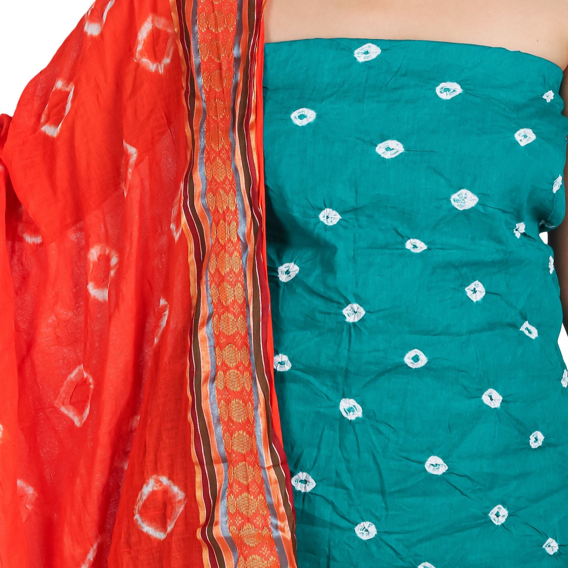 close-up view of teal color top with white bandhej prints