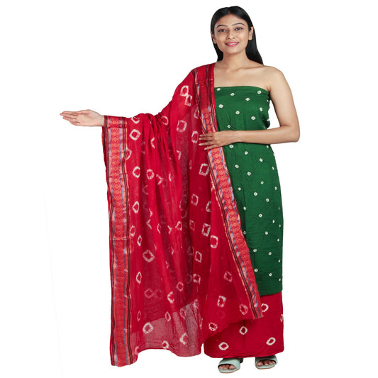 green bandhani dress material top, red bottom and dupatta all with white bandhej prints, dupatta has golden border
